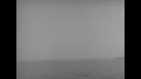 1945 - An SB2C Helldiver lands on a US Navy aircraft carrier. Stock Footage 173401776