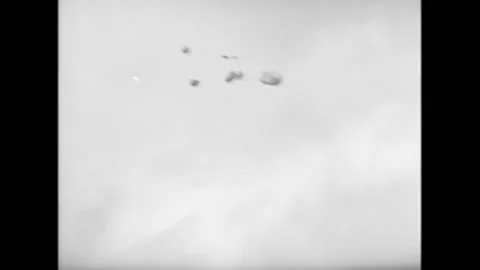 1945 - US Army Air Force C-47s drop rations by parachute in Burma. Stock Footage 164530705