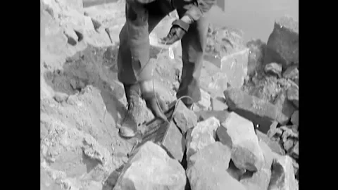 1945 - US Army engineers fix demolition charges and clear wreckage by hand and Stock Footage 164530976