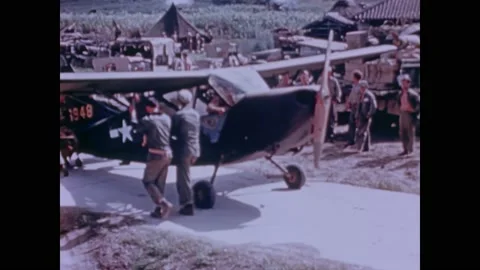 1945 - US Marines load their wounded onto small aircrafts for evacuation from Video stock 234532786