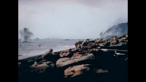 1945 - US Marines storm the beaches of Iwo Jima; the injured among them are Stock Footage 83424832