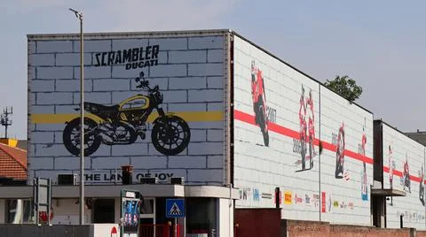 Bologna, Borgo Panigale - Italy - May 5, 2022: Headquarters of Ducati, Italian motorcycle manufacturing company. Commemorative wall with the most famous racing motorcycles. Bologna, Italy xkwx ducati, motorcycle, speed, race, motorbike, sport, motor, bike, transportation, transport, vehicle, fast, engine, moto, international, italian, technology, superbike, design, exhibition, illustrative editorial, racing, team, wheel, bologna borgo panigale, drive, motogp, championship, motorsport, modern, road, headquarters, competition, business, luxury, sbk, manufacturing company, expensive, show, event, made in italy, action, display, track, power, machine, metal, red, circuit, model