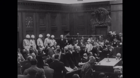 1946 - After the Nuremberg Trials end, MPs guard the cells where those sentenced Stock Footage 124168155