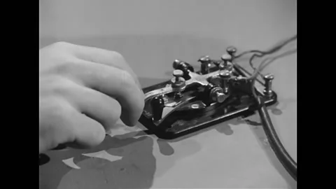 1946 - A soldier uses Morse code to transmit jazz lyrics. Stock Footage 157286103