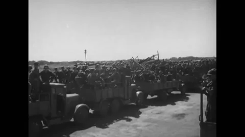 1946 - US troops are gathered at the Atsugi Airdrome airport awaiting trucks Stock Footage 221835523