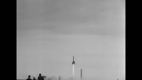 1946 - A V-2 rocket is fired at White Sands in New Mexico. The camera follows it Stock Footage 221835938