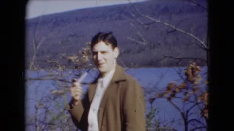 1947: charming man smoking pipe on the bank of river MIDDLETOWN Stock Footage