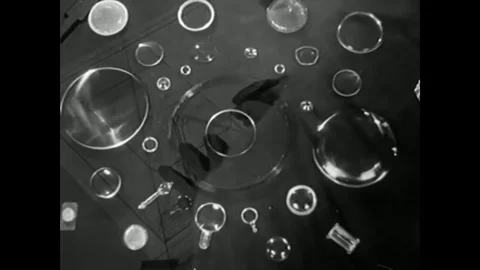 1947 - A decorative Plexiglas tray is washed in a sink and waxed by a housewife Stock-Footage 79451557