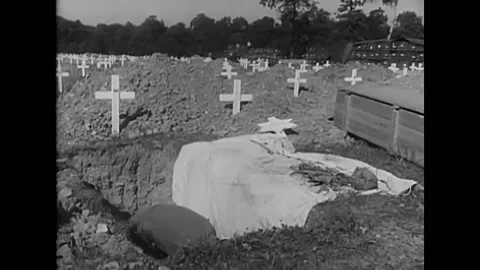 1947 - Grave-diggers in Belgium dig up corpses of American soldiers and place 스톡 동영상 238749232