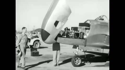 1947 - A pilot boards a chase plane and airmen confer on a United States Air Stock Footage 83041233