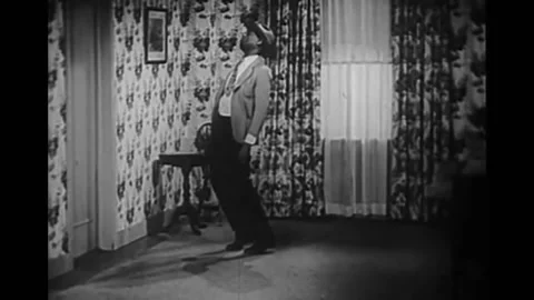 1948 - In this race comedy, a drunk man gets pantsed by a monkey in a boarding 스톡 동영상 203752291