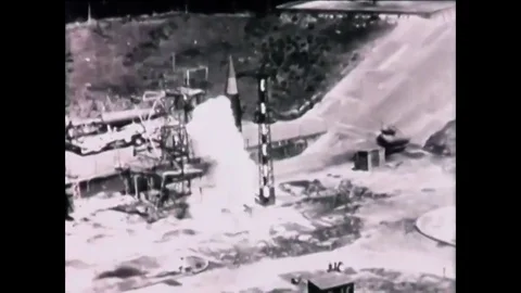 1948 - A rocket is launched and it crashes on the launchpad and an Stock Footage 83459528