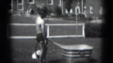 1949: boy filling metal tub with water MIDDLETOWN Stock Footage