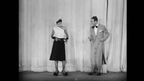 1949 - Jo Jo Adams performs with a striptease dancer in a Harlem burlesque show. 스톡 동영상 164453470