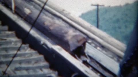 1949: Log Going Up Conveyor Belt Chain to Lumber Mill Processing Factory Stock Footage 58486252