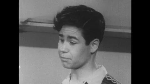 1949: Student takes broken toy and attempts to fix it. Stock Footage