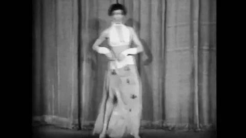 1949 - A woman performs a striptease in a Harlem burlesque show. Stock Footage 164453448