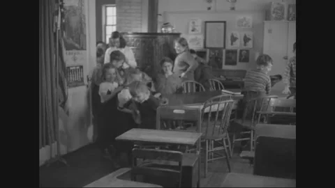 1950 - Children of different ages learn math and spelling at a one room Stock Footage 157156793