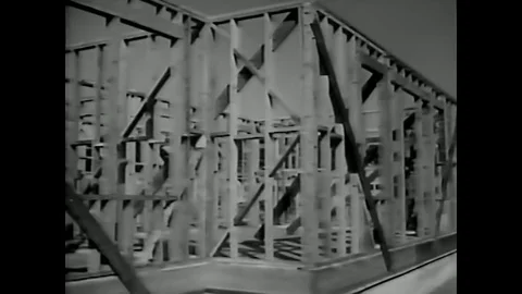 1950 - Knee braces are installed in a wall during the construction of a Stock Footage