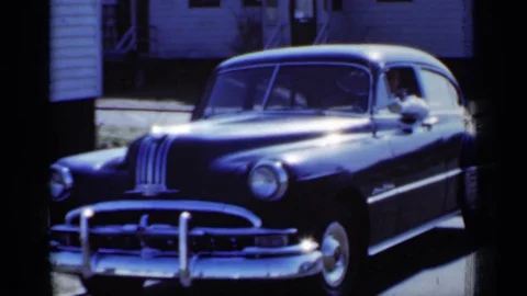 1950: Man Driving Car from Home Saying Bye to Wife Stock Footage 72906860