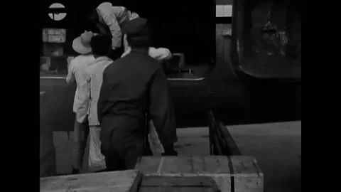 1950 - Men load crates into a plane, forklift lifts crates, wounded men on Video stock 205601859