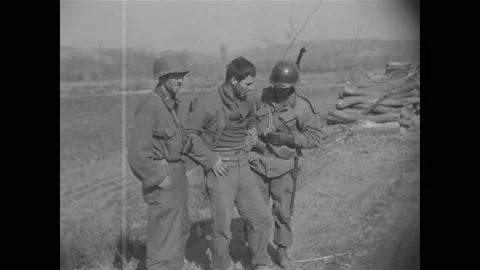 1950 - A wounded American soldier is hel... | Stock Video | Pond5