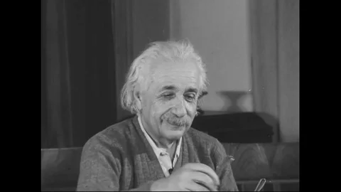 1950s - Albert Einstein American scientist and mathematician smiles and looks at Stock Footage 125694643
