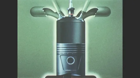 1950s: Animation. Cutaway view of a running engine. A turning crank makes engine Stock Footage