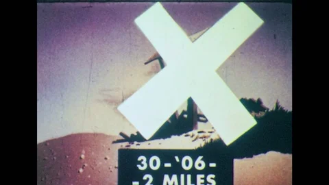 1950s: Animation of demolished building. Man in field with rifle. Man throws Stock Footage