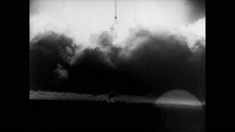1950s: Atomic blast.  Man covers window with blanket.  Men use Geiger counter Vidéo 160572685