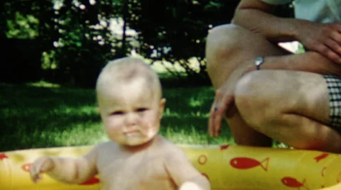 1950's Baby In Backyard Pool 動画素材 36596723