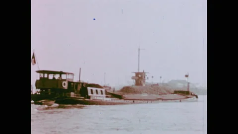 1950s: Barge on Rhine River. Map of Rhine River running through cities in Stock Footage 147402164