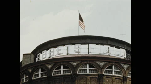 1950s: Baseball team on field. Man throws ball, men play baseball. Ebbets field Stock Footage 155123786