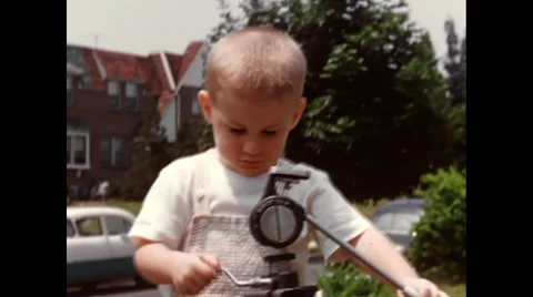 1950's boy with camera tripod outside playing Video stock 48138981