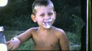 1950S Boy Eats Face Full Of Pie Cake Whipped Cream Vintage Film Home Movie Stock Footage
