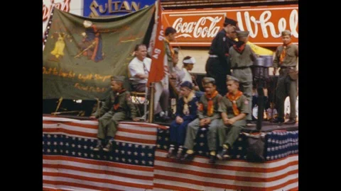 1950's: Boy Scouts float passes by in parade, followed by police platoon, horse Stock Footage 88596036