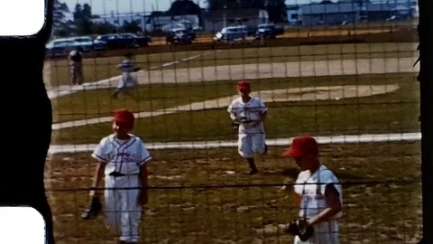 1950s boys baseball team returning to dugout. Vintage 8mm Home Video. Stock Footage 279860394