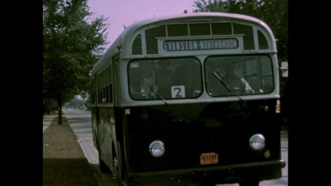 1950s: Bus pulls over and kids get off. Kids walk towards school. Stock Footage 249613902