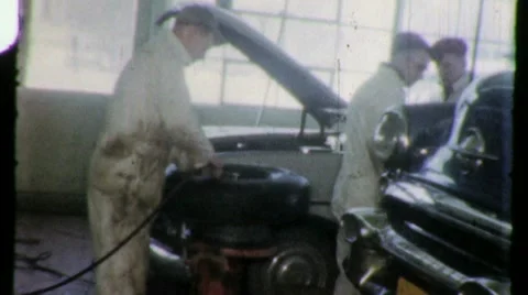 1950s Car Auto Flat Tire Repair Garage MECHANIC Men Work Vintage Film Home Movie Stock Footage 10171384