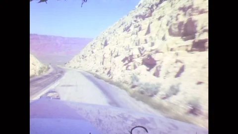 1950s: Car Drives Down Road. Sign Entering Navajo Reservation. Colorado River Stock Footage