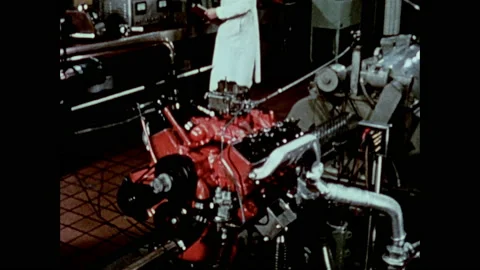 1950s: Car engine interior. Car engine in laboratory. Scientists run test on Stock Footage 152991924