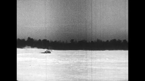 1950s: Cars are tested in snow and on a rail track. Stock Footage