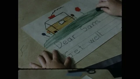 1950s: Child creates get wall note with crayons. Doctor and mother check on sick Stock Footage 169182019