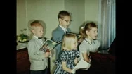1950S: Children Sing At Piano. Girl Plays Piano. Stock Footage