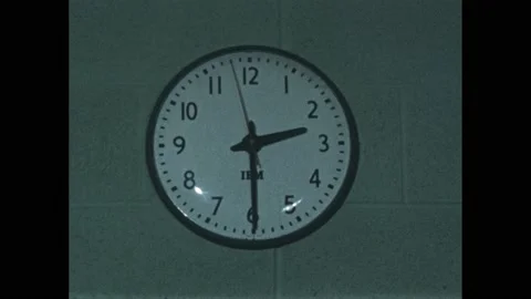 1950s: Clock on the wall jumping between various times. Stock Footage 165605665