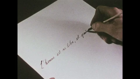 1950s: Close up, hand writes on paper with quill. Stock Footage 94210564