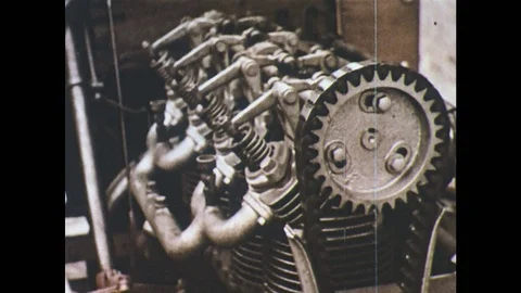 1950s: components of a motor car engine. Pistons and starter motor. Video stock 75174593