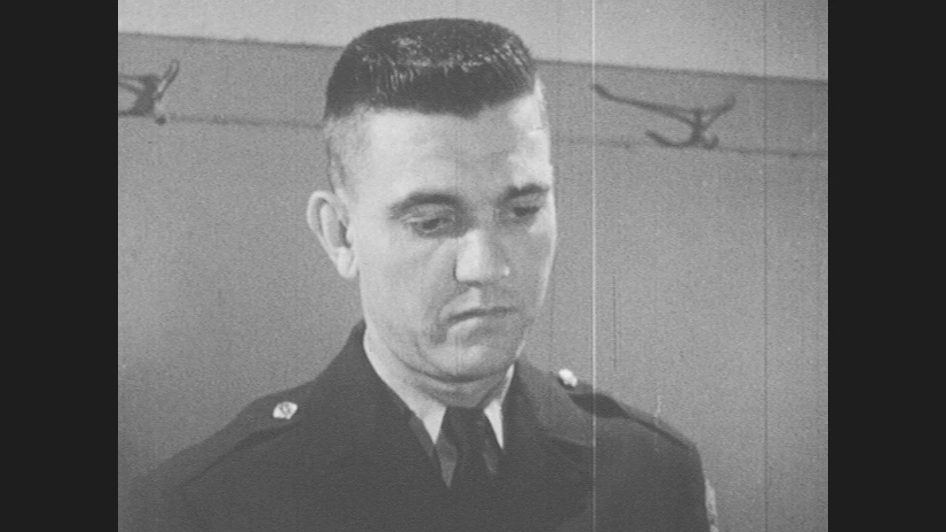 1950s: cop with buzzcut haircut looks do... | Stock Video | Pond5