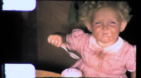 1950s Cute Little Girl Makes a Mess Eats Ice Cream Vintage Old Film Home Movie Stock Footage