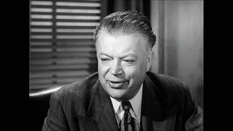 1950s: David Dubinsky talks. Dubinsky and William Green sit in an office and Video stock 162327542